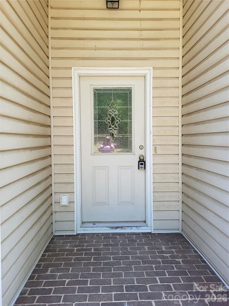 Front door - Reflection of the photographer's pink shirt is in window Front door - Reflection of the photographer's pink shirt is in window
