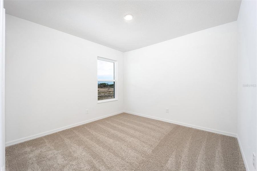 Spacious, unfurnished interior of a new home in Gum Lake Preserve, Lake Alfred (Image 14).
