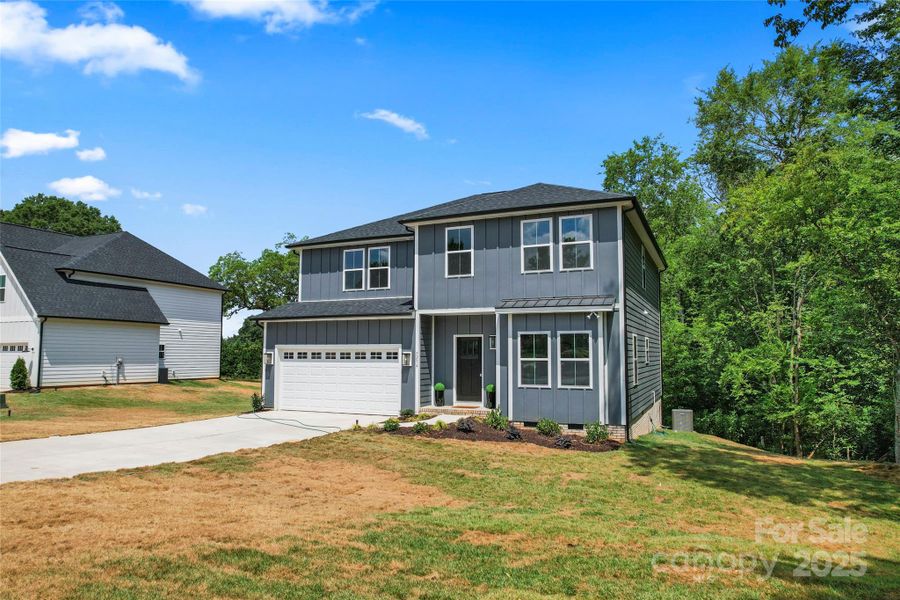 Front exterior of a new home in , Harrisburg, NC, highlighting curb appeal (Image 24).