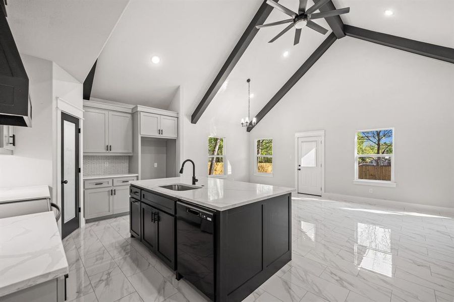 Kitchen featuring light marble finish floors, light stone countertops, stainless steel electric stove, recessed lighting, and backsplash