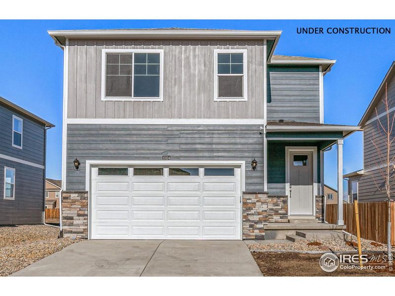 Front exterior of a new home in Tailholt, Severance, CO, highlighting curb appeal (Image 1).