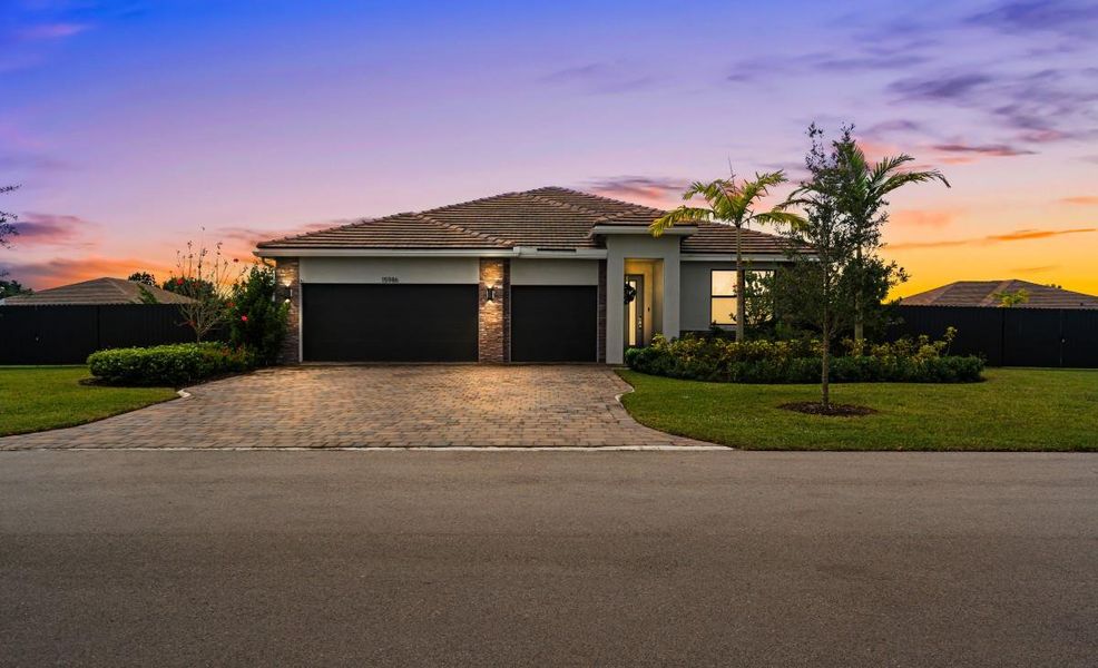 Front exterior of a new home in , Homestead, FL, highlighting curb appeal (Image 25). Front exterior of a new home in , Homestead, FL, highlighting curb appeal (Image 25).