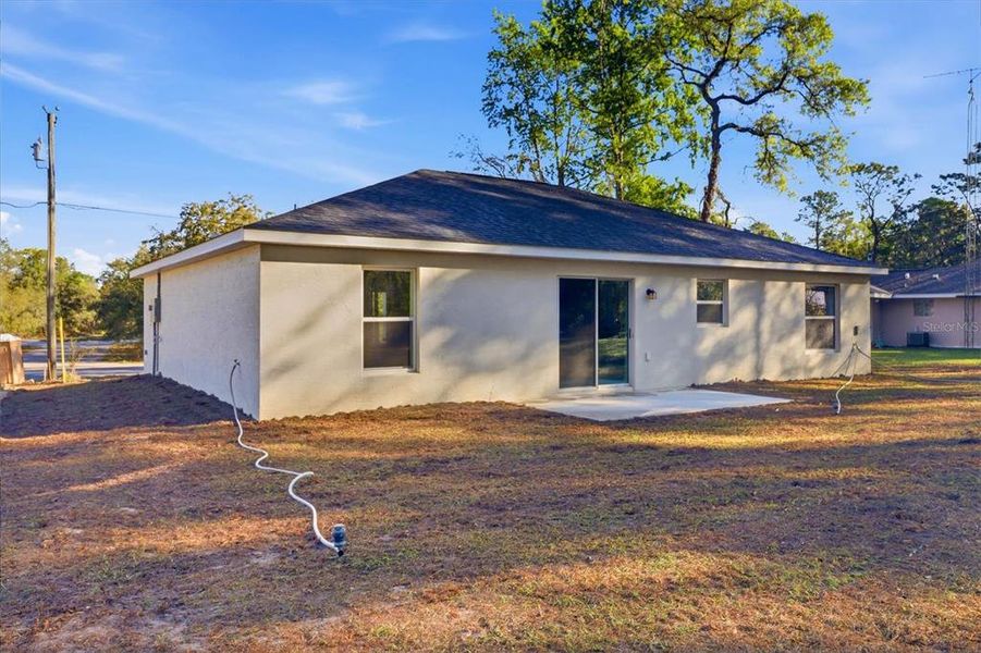 Exterior details and patio area of a home in , Citrus Springs (Image 24).