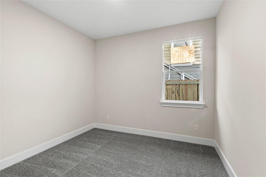 View of carpeted spare room