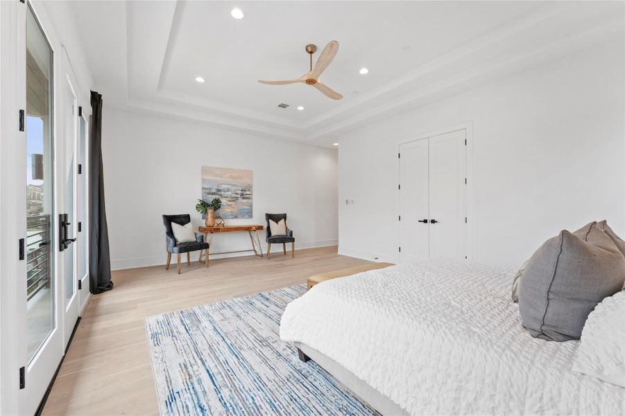 Serene retreat with designer finishes and coffered ceiling.