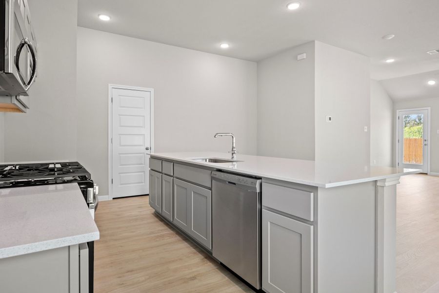 Kitchen in the Spruce home plan by Trophy Signature Homes - REPRESENTATIVE PHOTO Kitchen in the Spruce home plan by Trophy Signature Homes - REPRESENTATIVE PHOTO