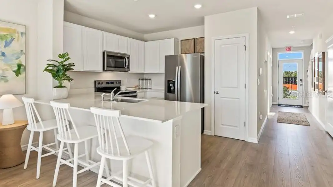 Furnished interior view inside a new home in Oasis at Longwood Run, Sarasota (Image 12).