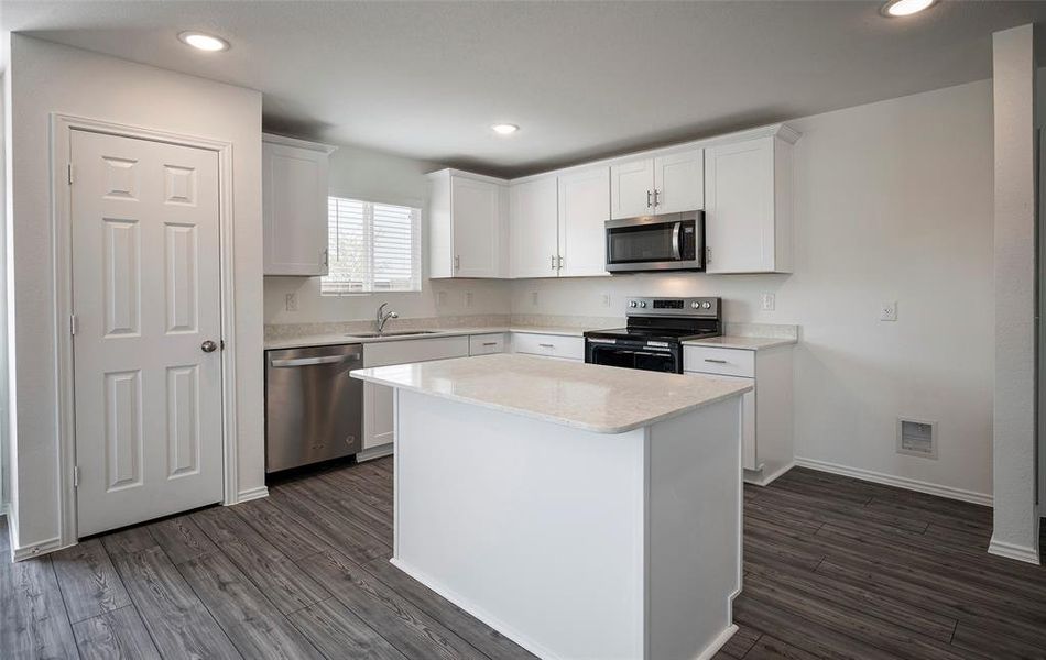 *floorplan representation, not actual home - Spacious kitchen with eat-in bartop island