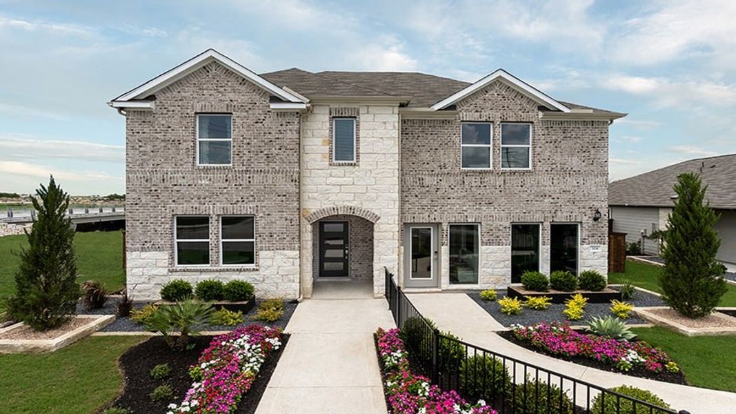 Representative exterior photo of a completed home built from the Trinity by Taylor Morrison in Emory Crossing 50s, Hutto, TX (Image 1).