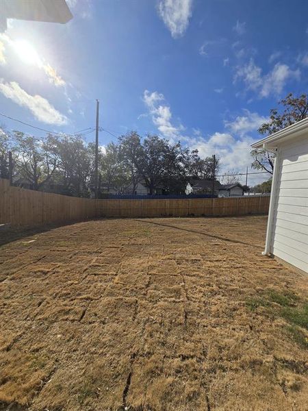View of fenced backyard
