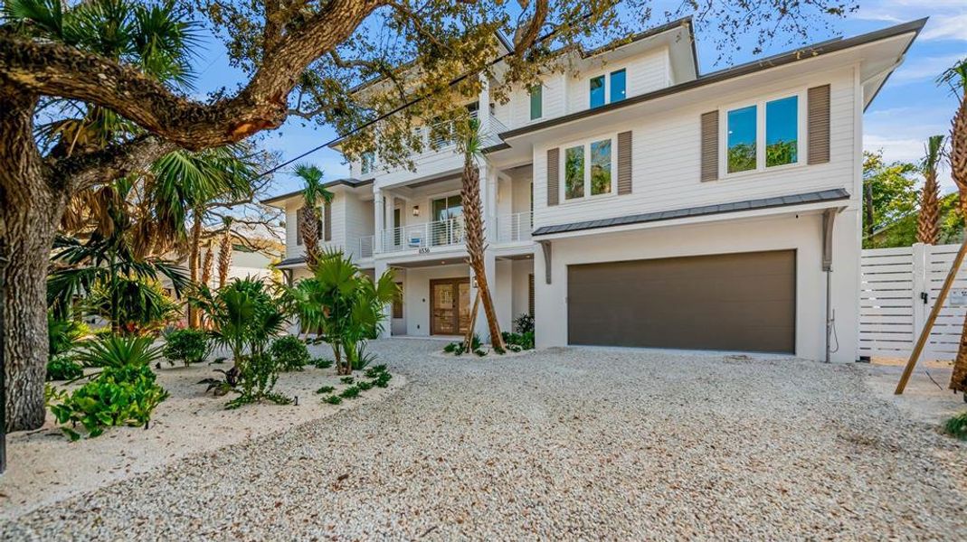 Front exterior of a new home in , Sarasota, FL, highlighting curb appeal (Image 2). Front exterior of a new home in , Sarasota, FL, highlighting curb appeal (Image 2).