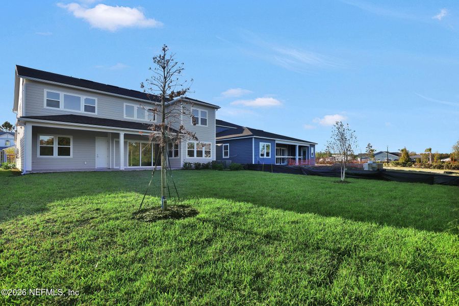 Exterior details and patio area of a home in The Landings at Saint Johns, St. Johns (Image 30).