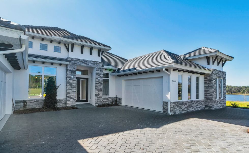 Front exterior of a new home in West Hill Estates, Dade City, FL, highlighting curb appeal (Image 18).