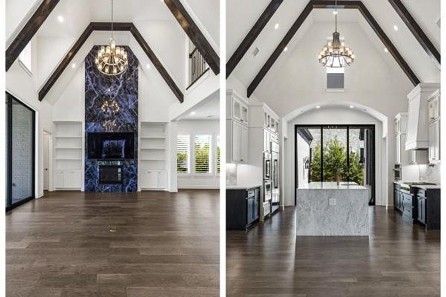 Unfurnished living room with a chandelier, high vaulted ceiling, dark wood-type flooring, and a premium fireplace Unfurnished living room with a chandelier, high vaulted ceiling, dark wood-type flooring, and a premium fireplace