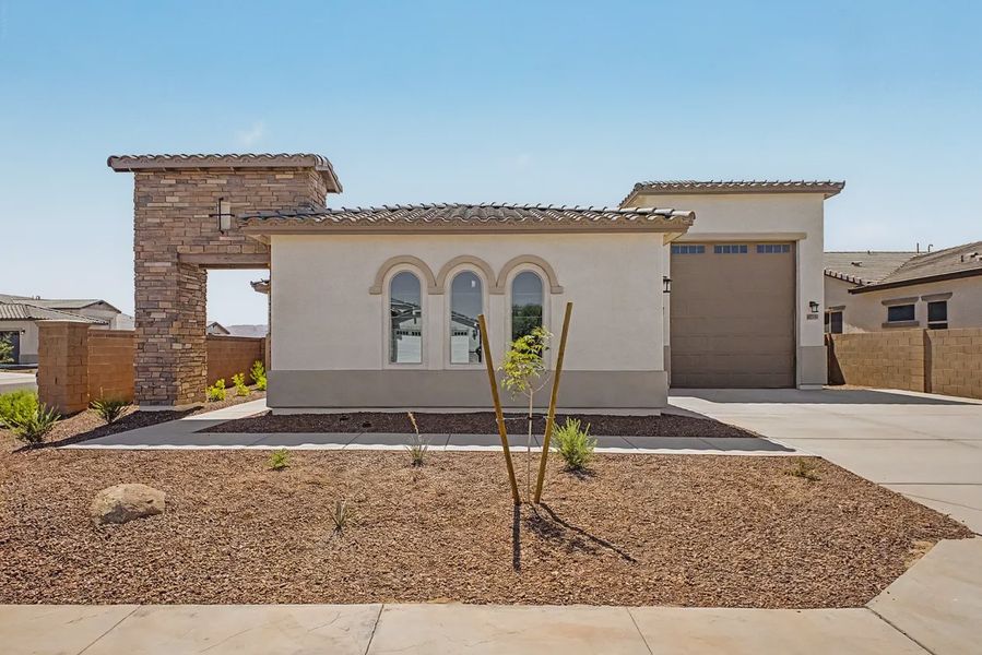 Front exterior of a new home in Valencia at Granite Vista, Waddell, AZ, highlighting curb appeal (Image 19).