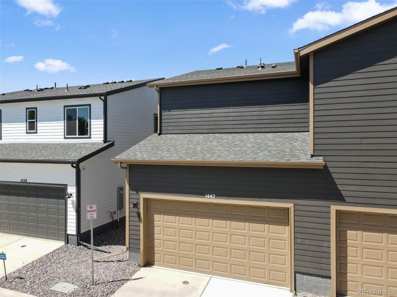 Front exterior of a new home in Spring Valley, Longmont, CO, highlighting curb appeal (Image 17).