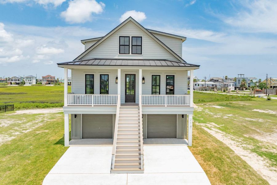 Front exterior of a new home in , Galveston, TX, highlighting curb appeal (Image 24).