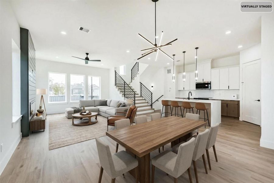 Virtually staged dining area and living room.