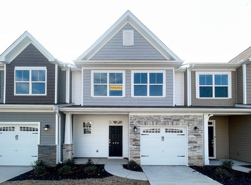 Front exterior of a home in the Attenborough Townhomes community, located in Piedmont, SC (Image 8).