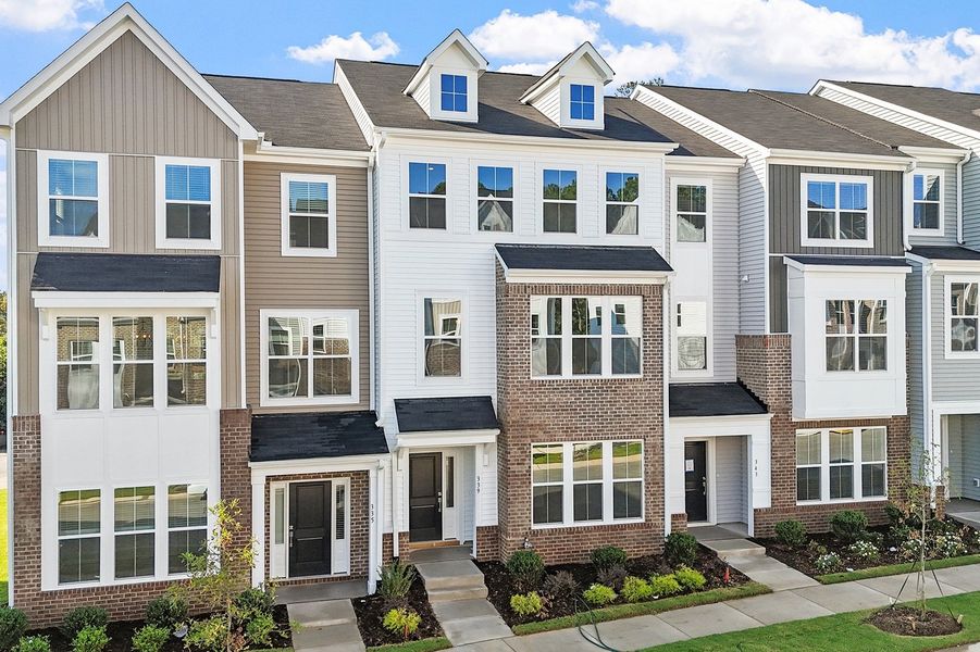 Front exterior of a new home in Renaissance at White Oak, Garner, NC, highlighting curb appeal (Image 2). Front exterior of a new home in Renaissance at White Oak, Garner, NC, highlighting curb appeal (Image 2).