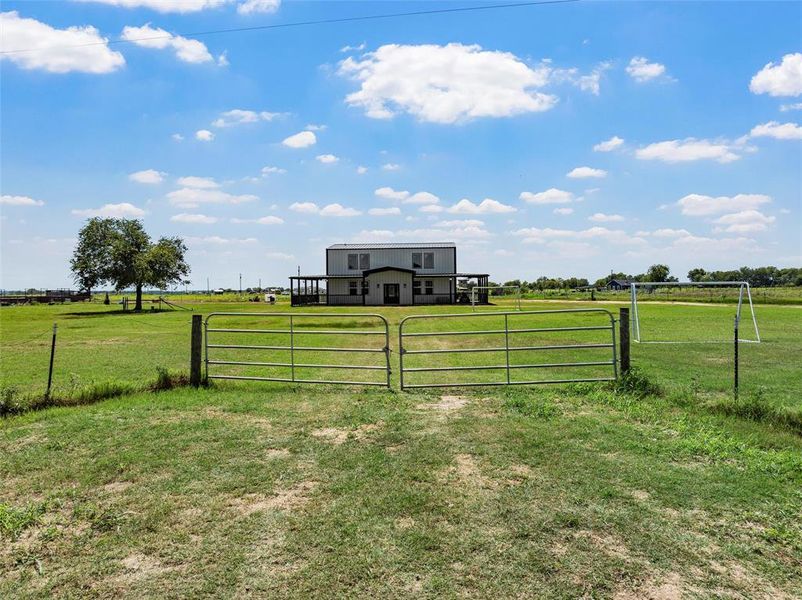 Gate featuring a view of countryside Gate featuring a view of countryside