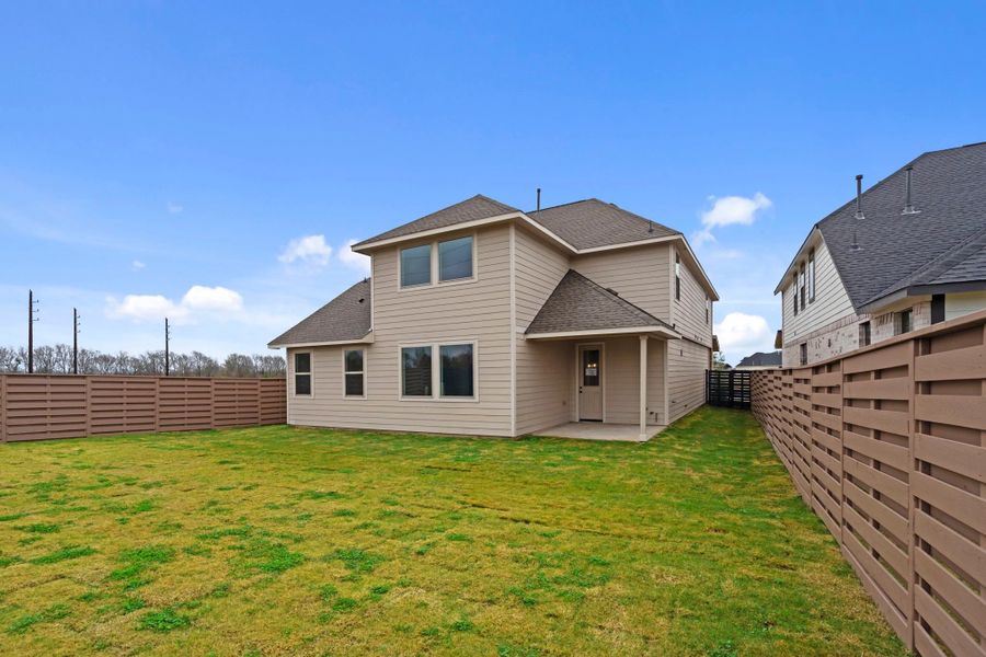A generously sized backyard is ready to host friends and family.