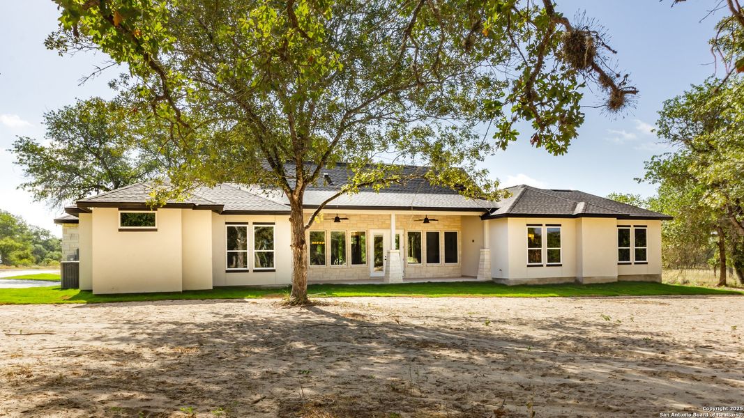 Front exterior of a new home in , La Vernia, TX, highlighting curb appeal (Image 20).