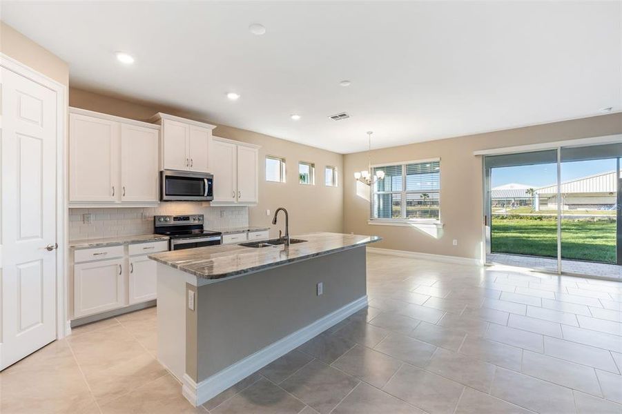 Furnished interior view inside a new home in Deep Creek Tradition Series, Punta Gorda (Image 8).