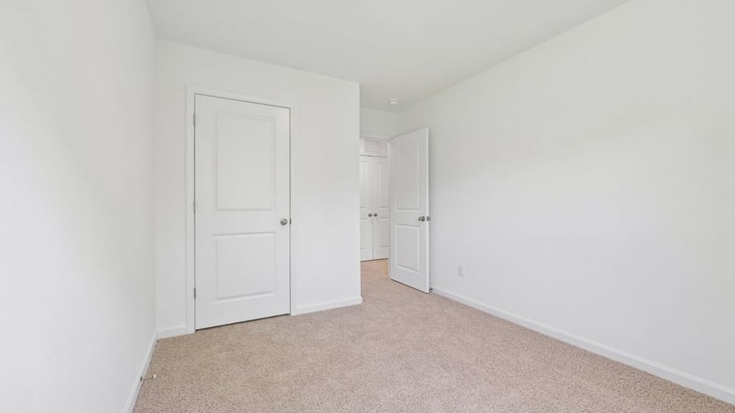 Spacious, unfurnished interior of a new home in The Townes at Belle Grove, Wendell (Image 18).