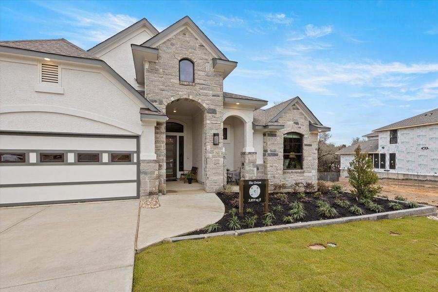 Front exterior of a new home in 6 Creeks, Kyle, TX, highlighting curb appeal (Image 20).