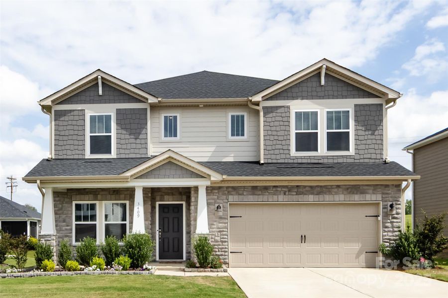 Front exterior of a new home in Simpson Farms, Monroe, NC, highlighting curb appeal (Image 25).