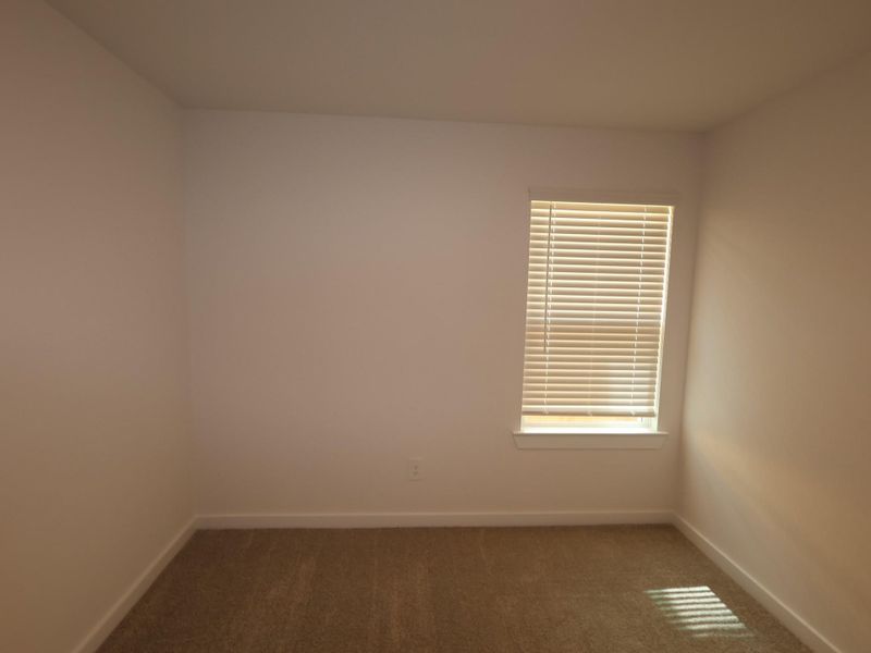 Spacious, unfurnished interior of a new home in Pinewood at Grand Texas, New Caney (Image 18).