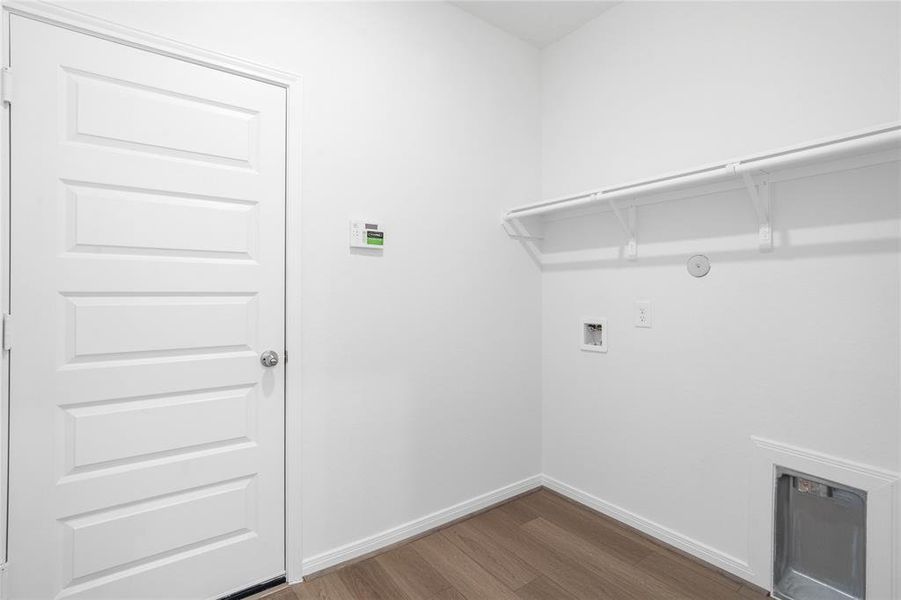 The Utility Room is spacious for your washer & dryer appliances and has a high shelf for all your laundering supplies.