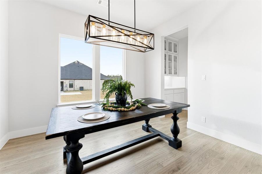 Dining space with light wood finished floors