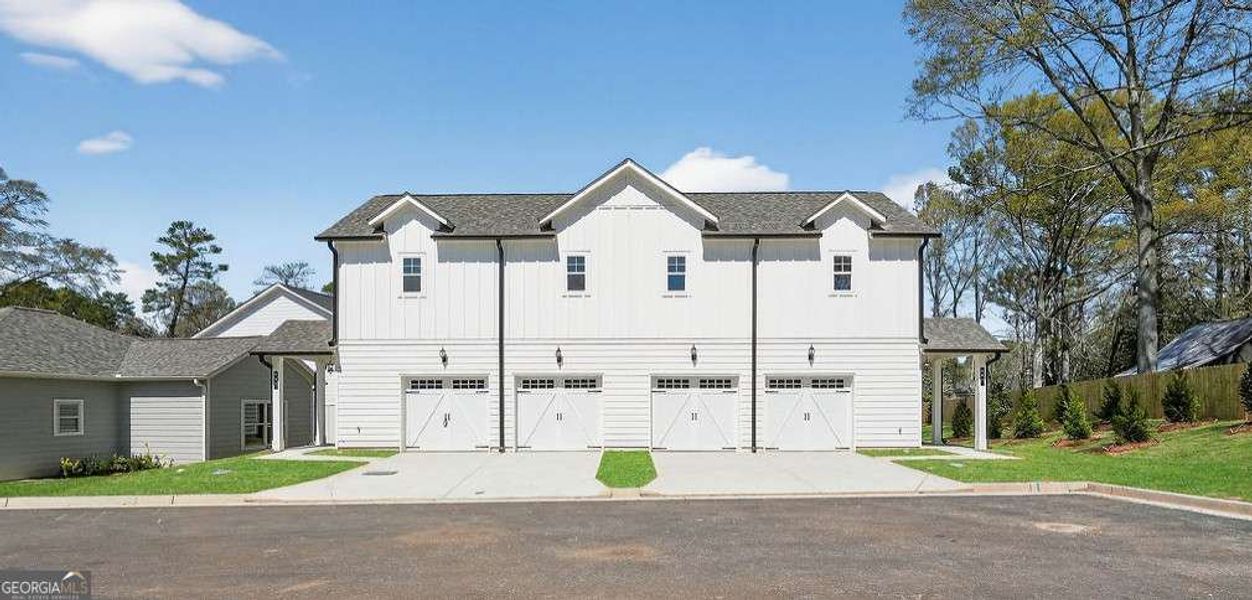 Front exterior of a new home in The Cottages at East Lanier, Fayetteville, GA, highlighting curb appeal (Image 16).