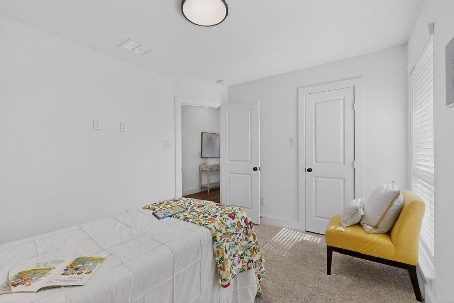 Bedroom featuring carpet flooring and baseboards Bedroom featuring carpet flooring and baseboards