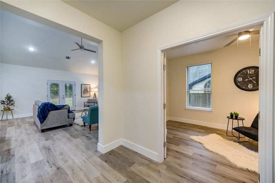 Experience a seamless flow from the entryway into the inviting living area and cozy bonus room, perfect for relaxation or work.