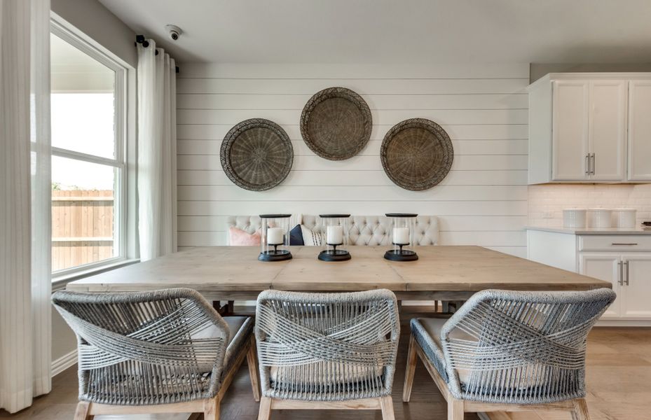 Dining space off kitchen with large windows