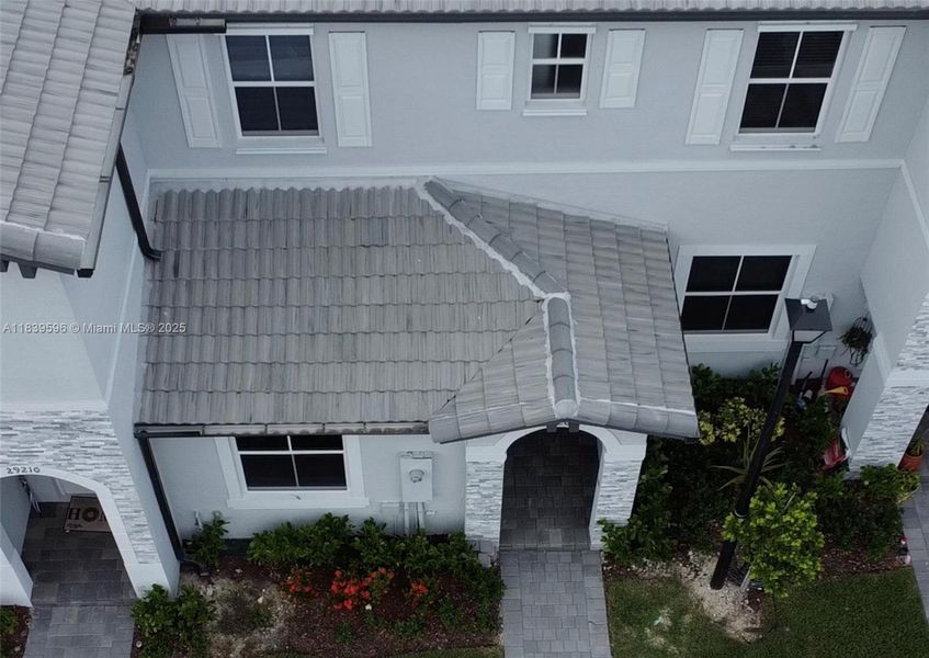 Front exterior of a new home in , Homestead, FL, highlighting curb appeal (Image 2). Front exterior of a new home in , Homestead, FL, highlighting curb appeal (Image 2).