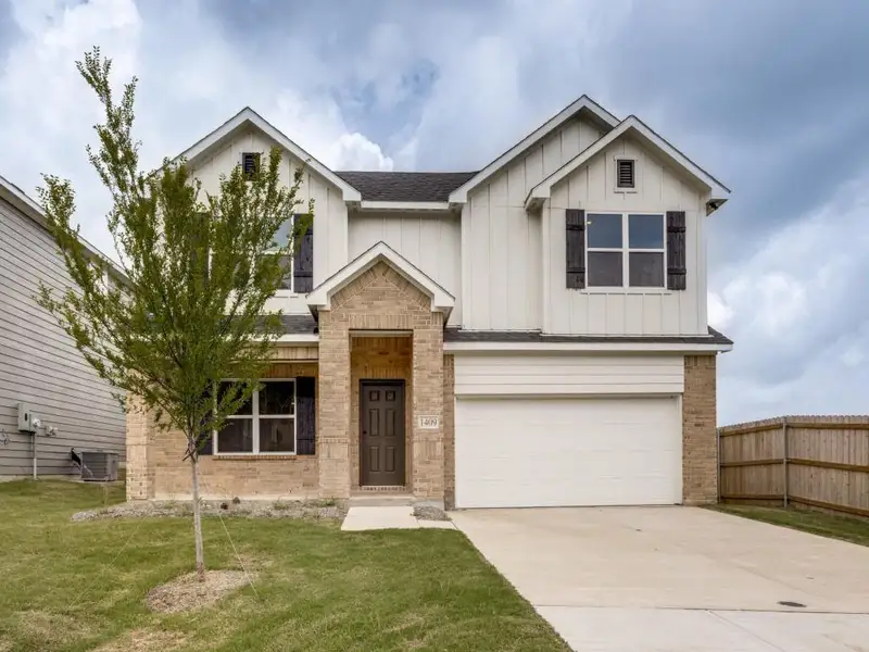 Front exterior of a new home in , Sherman, TX, highlighting curb appeal (Image 1). Front exterior of a new home in , Sherman, TX, highlighting curb appeal (Image 1).