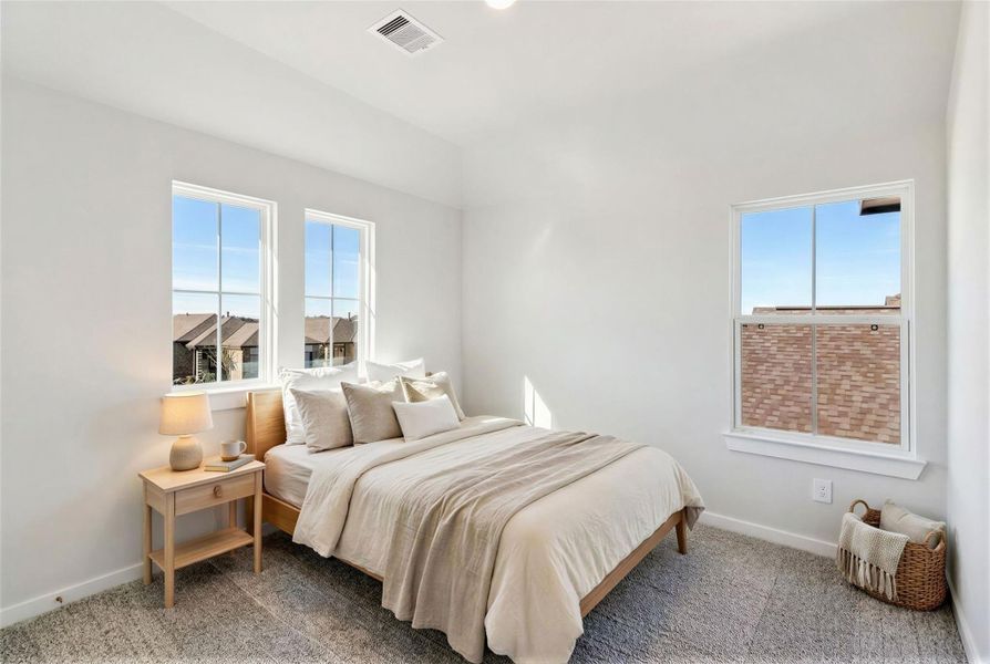 Virtually staged representation of the secondary bedroom.