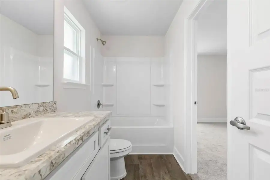 Representative furnished interior of a home built from the 2117 by Adams Homes in Flagler Estates, Hastings (Image 12).