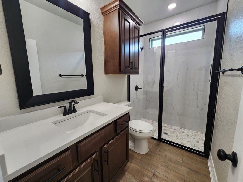 Elegant shower with sleek black framing and integrated glass panels creates a sophisticated bathroom retreat. Elegant shower with sleek black framing and integrated glass panels creates a sophisticated bathroom retreat.