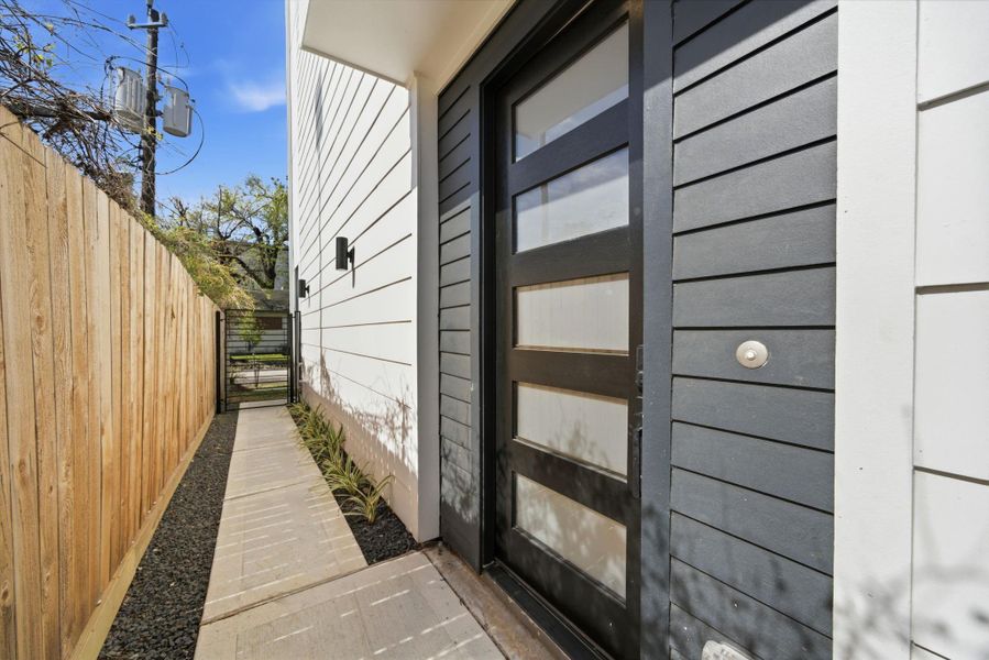 triking modern entry with clean architectural lines, a sleek front door, and thoughtfully curated finishes that create an inviting first impression. triking modern entry with clean architectural lines, a sleek front door, and thoughtfully curated finishes that create an inviting first impression.