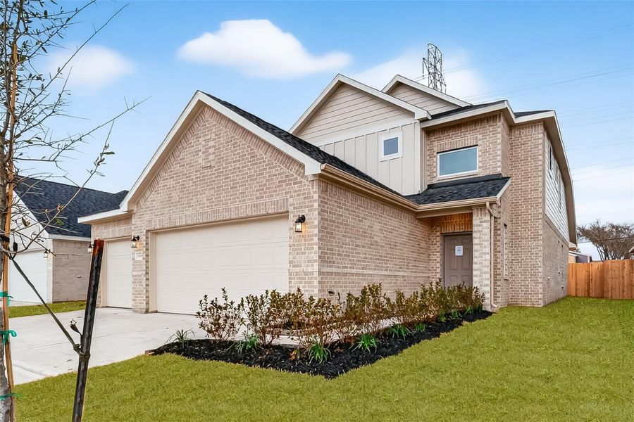 Front exterior of a new home in Rollingbrook Estates, Baytown, TX, highlighting curb appeal (Image 24).