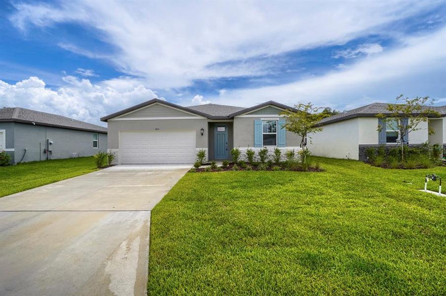 Front exterior of a new home in Salt Meadows - Classic Series, Parrish, FL, highlighting curb appeal (Image 19).