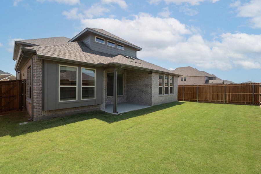 Exterior details and patio area of a home in Valencia on the Lake, Little Elm (Image 2).