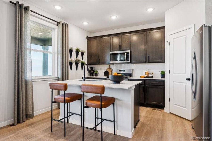 Furnished interior view inside a new home in Sweetgrass, Dacono (Image 5).