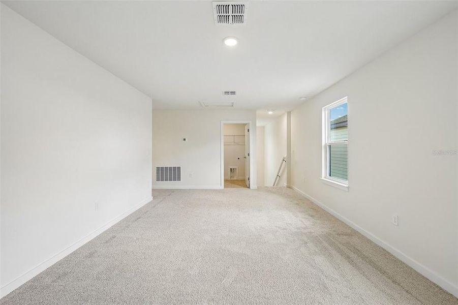 Spacious, unfurnished interior of a new home in Grasslands West, Lakeland (Image 30).