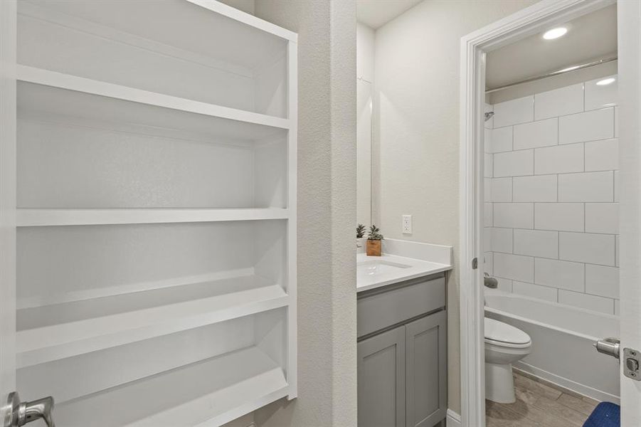 Built-in shelving unit providing storage Built-in shelving unit providing storage